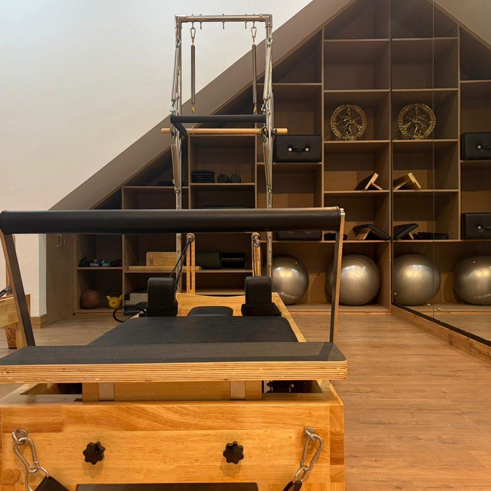 Pilates reformer and trapeze tower at Carry Wellness